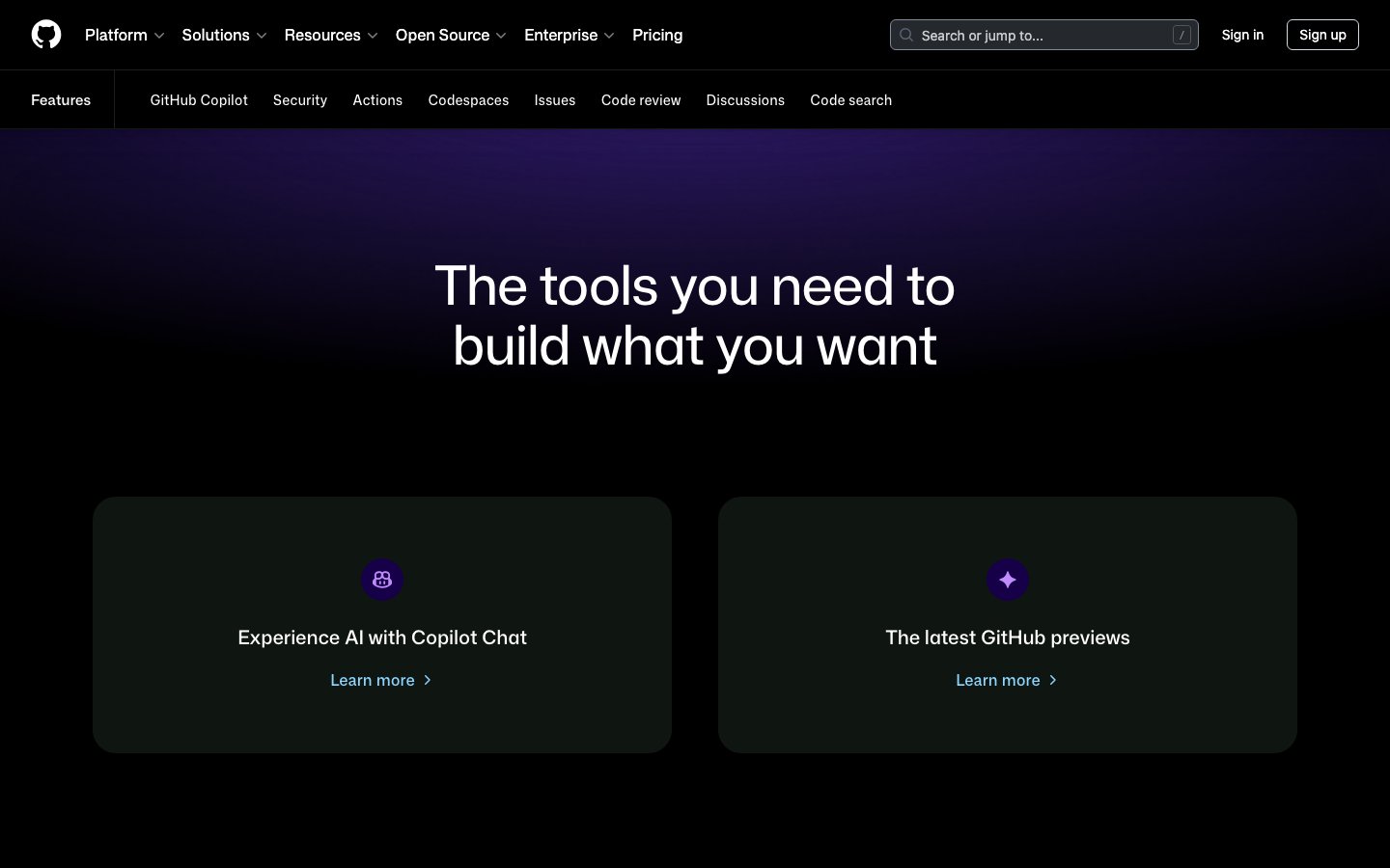 GitHub - Dark Mode als Standard Dark Mode Design 2026 - GitHub Features Seite mit dunklem Farbschema