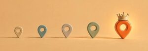 Fünf Standort-Pins in aufsteigender Größe, der größte mit Krone und Leuchten als Symbolbild für den ersten Platz im Google-Maps-Ranking